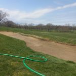 Panoramic view of a lush green golf course at Deer Trace Golf Course. Smooth