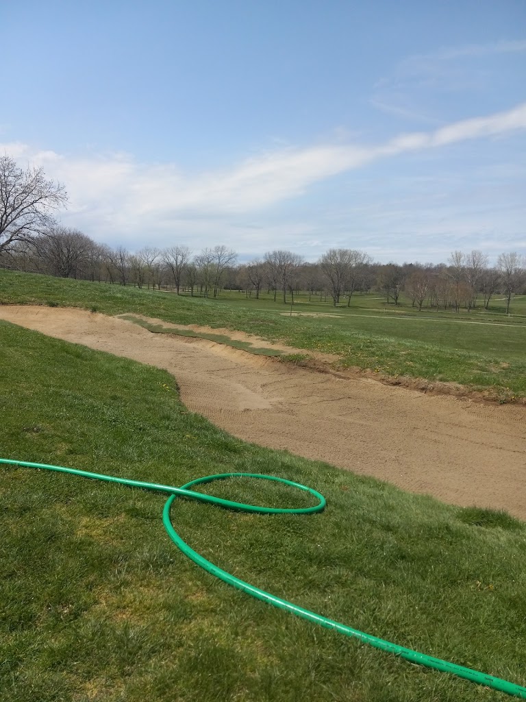 Panoramic view of a lush green golf course at Deer Trace Golf Course. Smooth