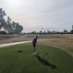 green grass with the flag in the hole.