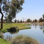 Panoramic view of a lush green golf course at Deer Valley Golf Course. Smooth