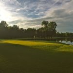 Panoramic view of a lush green golf course at Deerfield Golf Club. Smooth