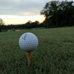 green grass with the flag in the hole.