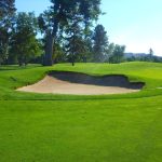 Panoramic view of a lush green golf course at Denver Country Club. Smooth