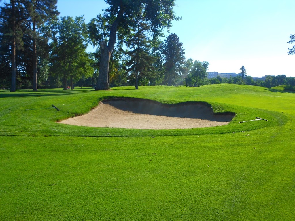 Panoramic view of a lush green golf course at Denver Country Club. Smooth
