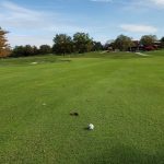Panoramic view of a lush green golf course at Des Moines Golf and Country Club. Smooth
