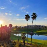 Panoramic view of a lush green golf course at Desert Canyon Golf Club. Smooth