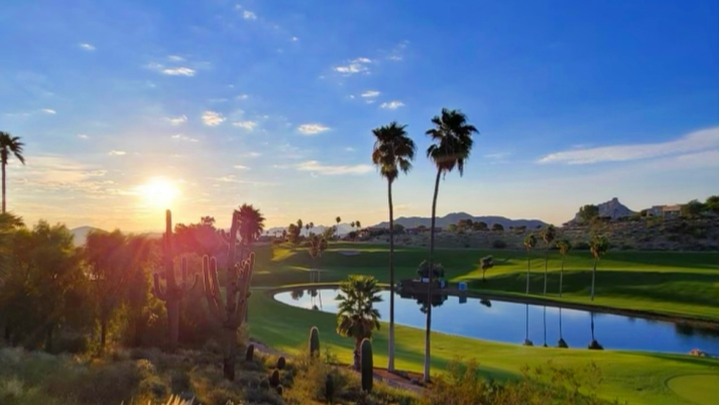 Panoramic view of a lush green golf course at Desert Canyon Golf Club. Smooth