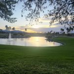 Panoramic view of a lush green golf course at Desert Springs Golf Course. Smooth