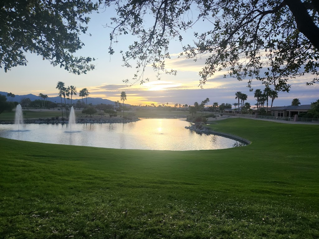 Panoramic view of a lush green golf course at Desert Springs Golf Course. Smooth