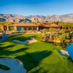 Panoramic view of a lush green golf course at Desert Willow Golf Resort. Smooth