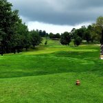 Panoramic view of a lush green golf course at Devou Park Golf Course. Smooth