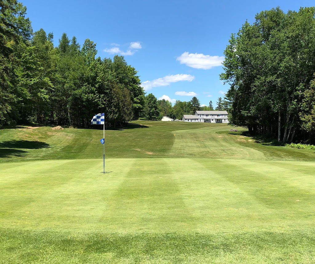 Panoramic view of a lush green golf course at Dexter Municipal Golf Course. Smooth