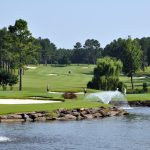 Panoramic view of a lush green golf course at Diamante Country Club. Smooth