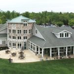 Panoramic view of a lush green golf course at Diamond Ridge Golf Course. Smooth