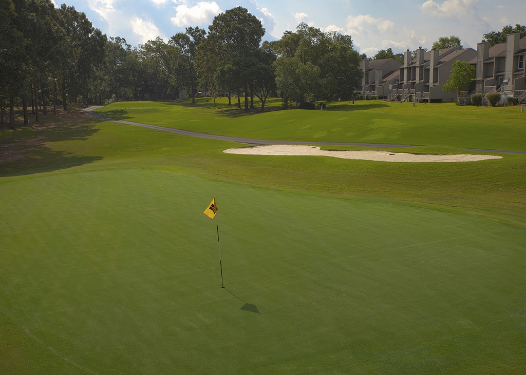 Panoramic view of a lush green golf course at Diamondhead Golf Course. Smooth