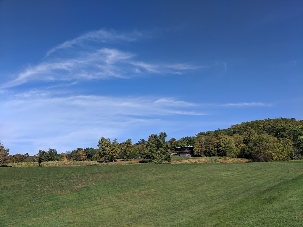 Panoramic view of a lush green golf course at Dinsmore Golf Course. Smooth