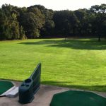 Panoramic view of a lush green golf course at Dix Hills Park Golf Course. Smooth