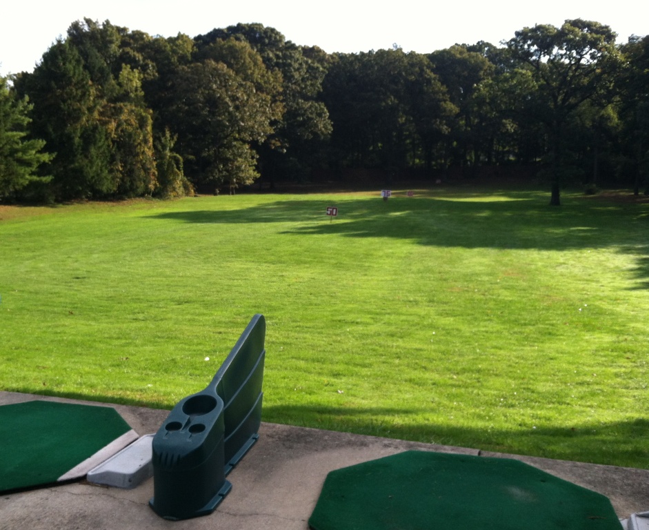 Panoramic view of a lush green golf course at Dix Hills Park Golf Course. Smooth