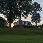 Panoramic view of a lush green golf course at Dixie Oaks Golf Club. Smooth