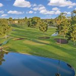 Panoramic view of a lush green golf course at Dobson Ranch Golf Course. Smooth
