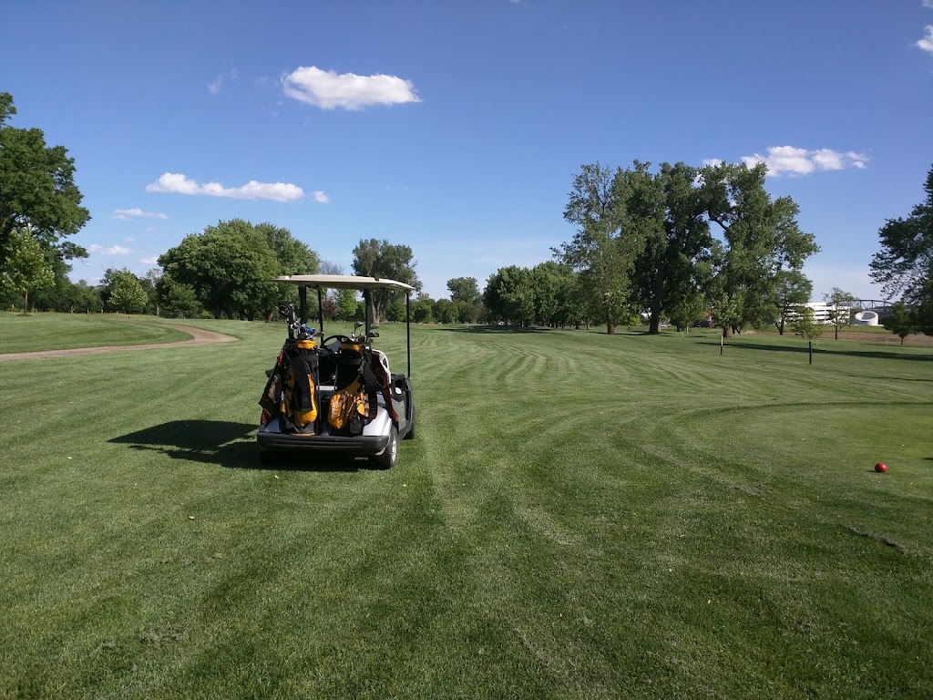 Panoramic view of a lush green golf course at Dodge Riverside Golf Club. Smooth