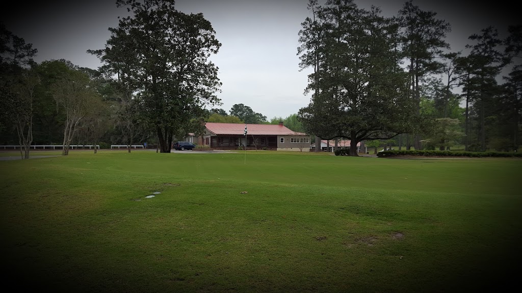 Panoramic view of a lush green golf course at Dogwood Hills Golf Course. Smooth