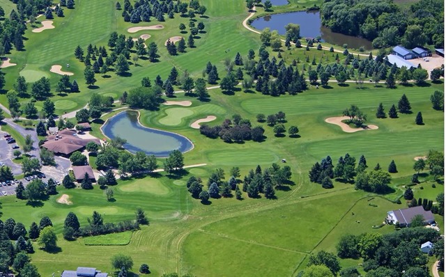 Panoramic view of a lush green golf course at Door Creek Golf Course. Smooth