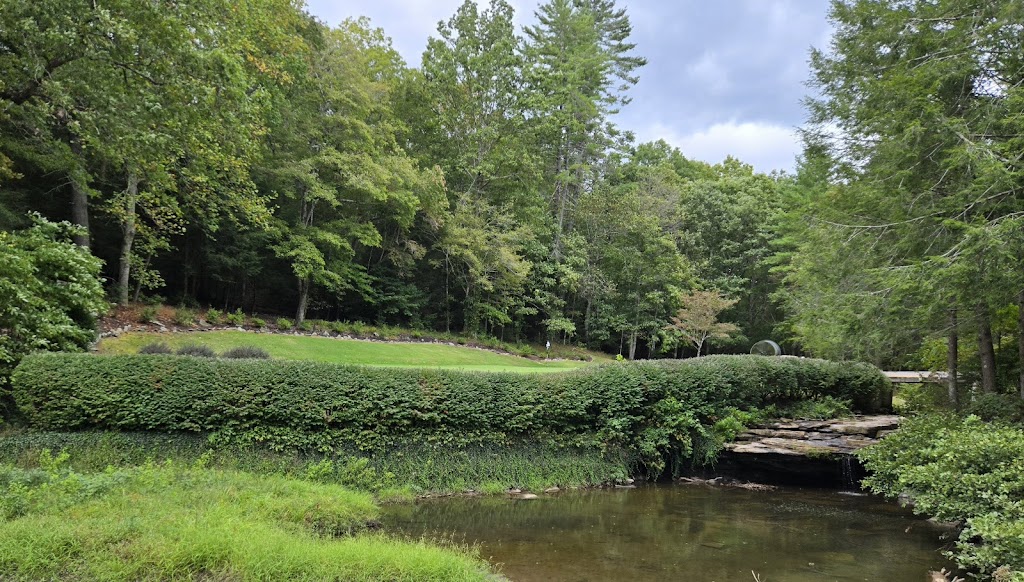 Panoramic view of a lush green golf course at Dorchester Golf Club. Smooth