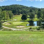 Panoramic view of a lush green golf course at Dorset Field Club. Smooth