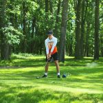 Panoramic view of a lush green golf course at Double Eagle Golf & Grille. Smooth