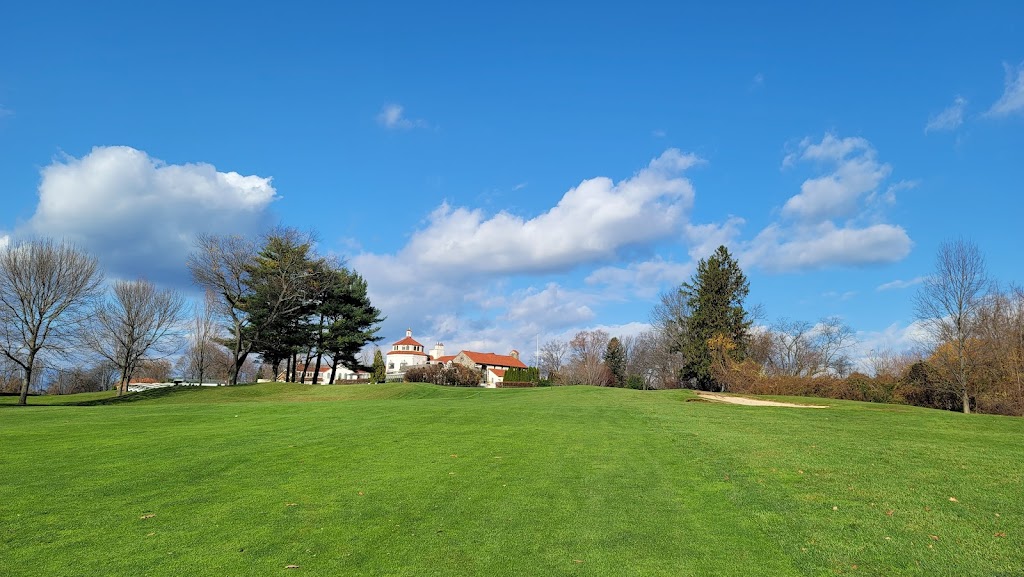 Panoramic view of a lush green golf course at Douglaston Golf Course. Smooth