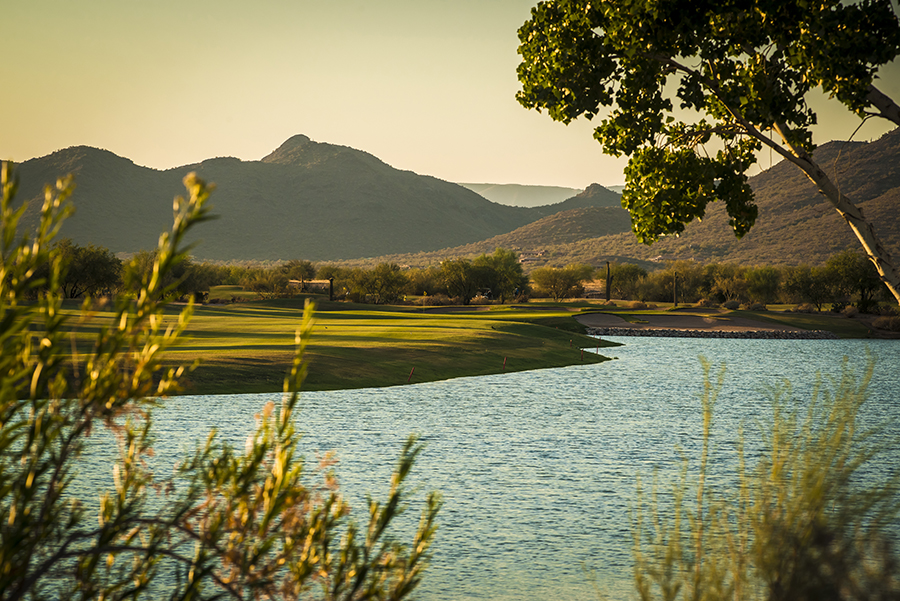 Panoramic view of a lush green golf course at Dove Valley Ranch Golf Club. Smooth