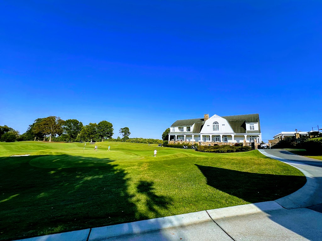 Panoramic view of a lush green golf course at Druid Hills Golf Club. Smooth