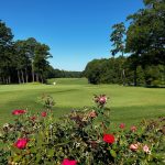Panoramic view of a lush green golf course at Duke University Golf Club. Smooth