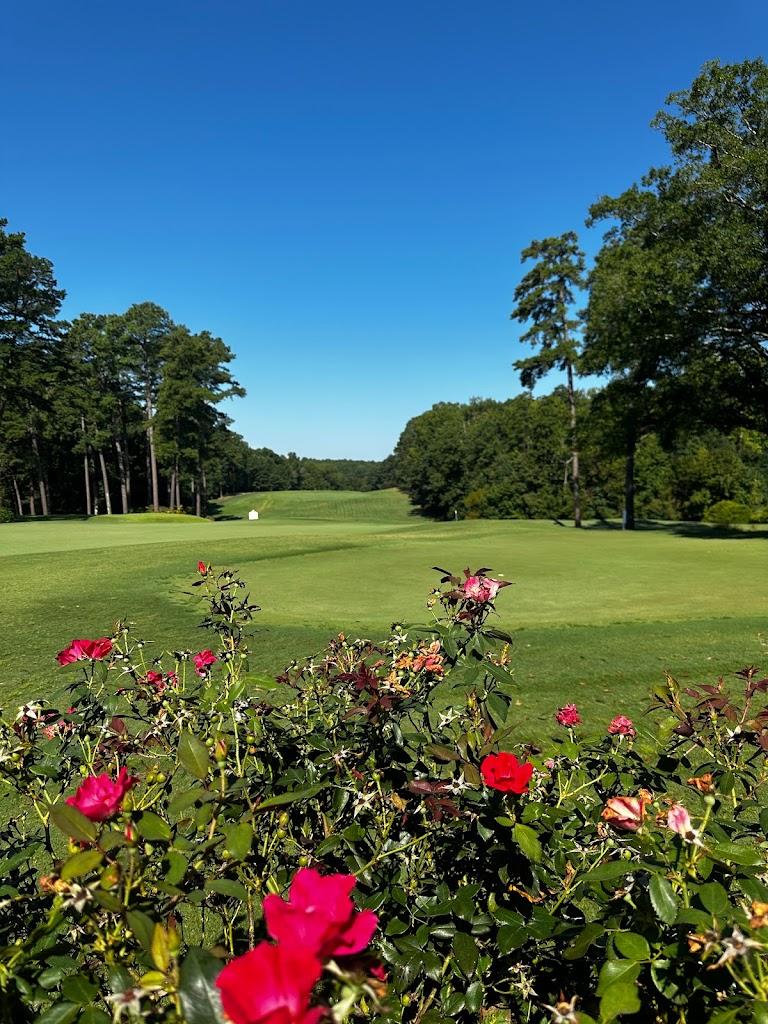 Panoramic view of a lush green golf course at Duke University Golf Club. Smooth