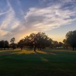 Panoramic view of a lush green golf course at Duncan Golf & Tennis Club. Smooth