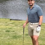 green grass with the flag in the hole.
