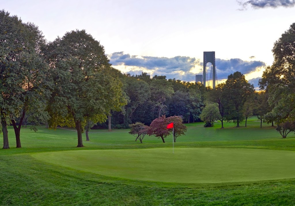 Panoramic view of a lush green golf course at Dyker Beach Golf Course. Smooth