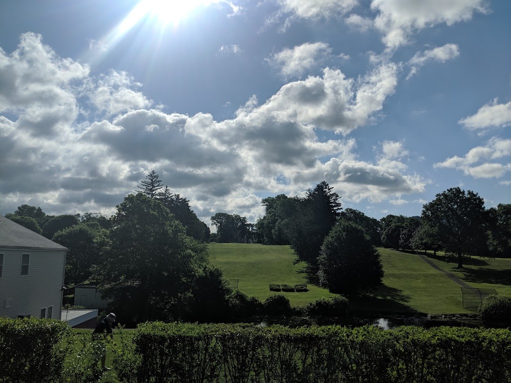 Panoramic view of a lush green golf course at E. Gaynor Brennan Golf Course. Smooth