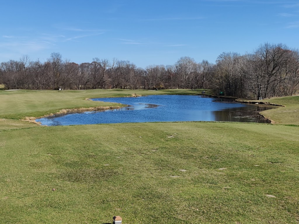 Panoramic view of a lush green golf course at Eagle Creek Golf Club. Smooth