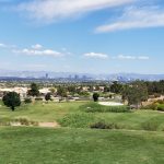Panoramic view of a lush green golf course at Eagle Crest. Smooth