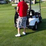 green grass with the flag in the hole.