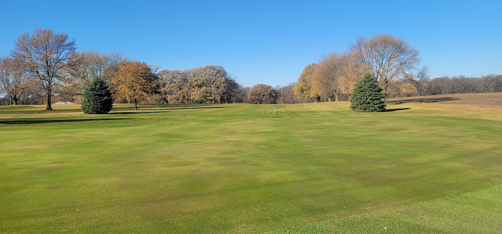 Panoramic view of a lush green golf course at Eagle Grove Golf Course. Smooth