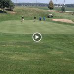 green grass with the flag in the hole.