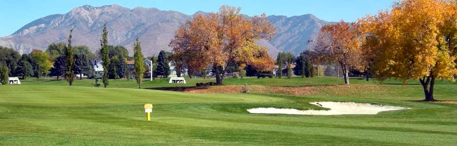 Panoramic view of a lush green golf course at Eagle Lake Golf Course. Smooth
