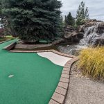 Panoramic view of a lush green golf course at Eagle Landing Golf Course. Smooth