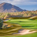 Panoramic view of a lush green golf course at Eagle Mountain Golf Club. Smooth