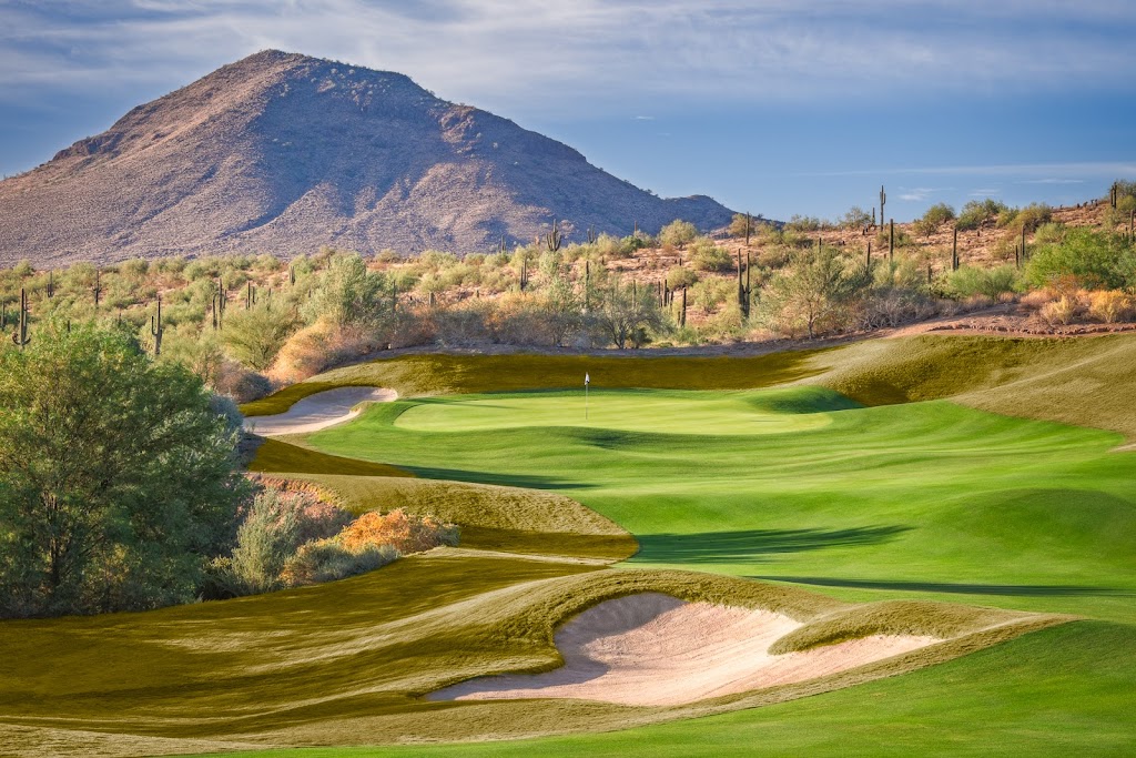 Panoramic view of a lush green golf course at Eagle Mountain Golf Club. Smooth