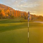 Panoramic view of a lush green golf course at Eagle Mountain Golf Course. Smooth