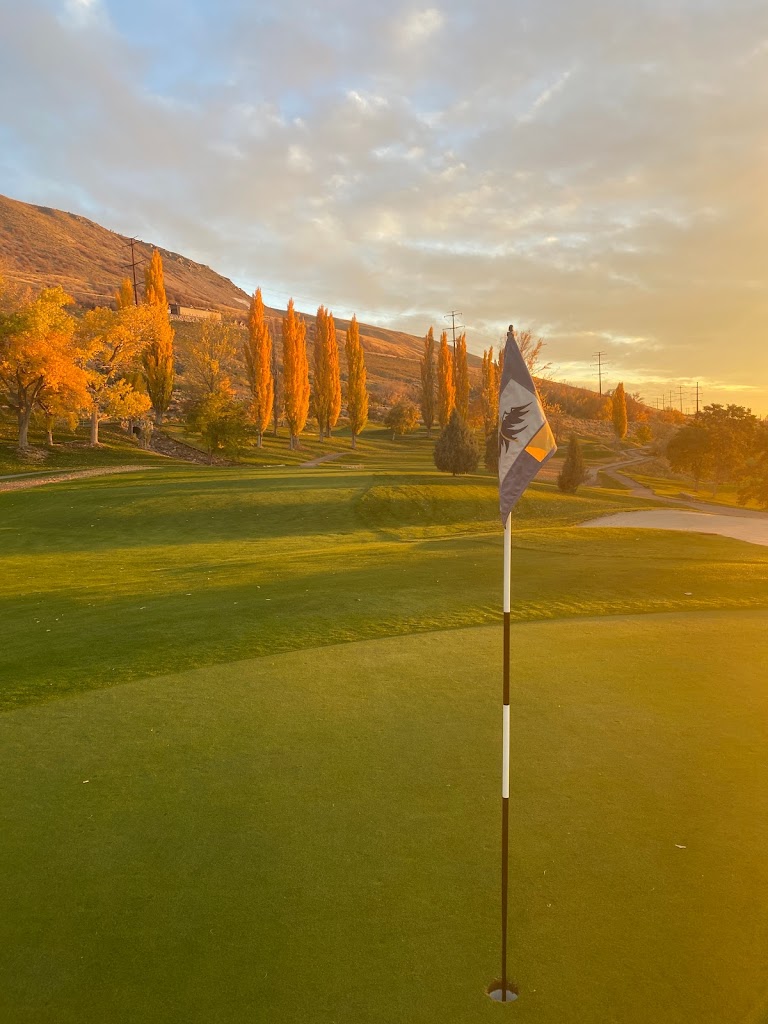 Panoramic view of a lush green golf course at Eagle Mountain Golf Course. Smooth